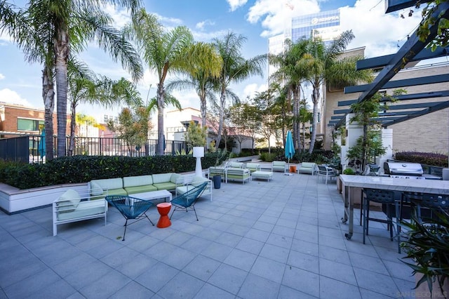 view of patio / terrace with an outdoor hangout area, grilling area, and a pergola