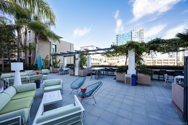 view of patio with an outdoor living space and a pergola