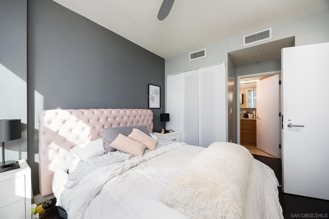 bedroom featuring a closet, vaulted ceiling, and ceiling fan