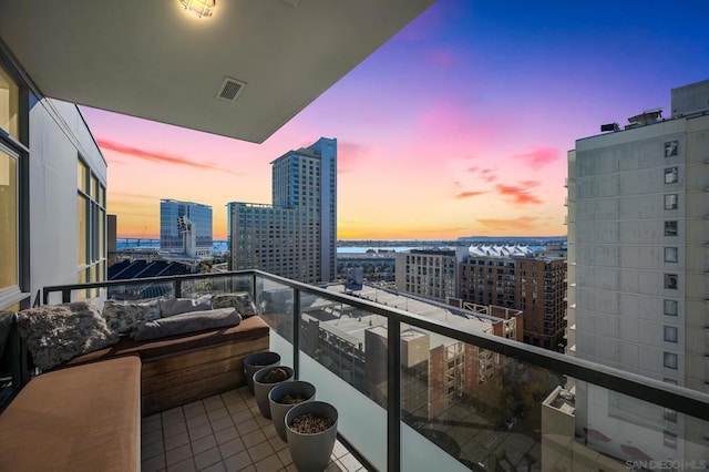 view of balcony at dusk