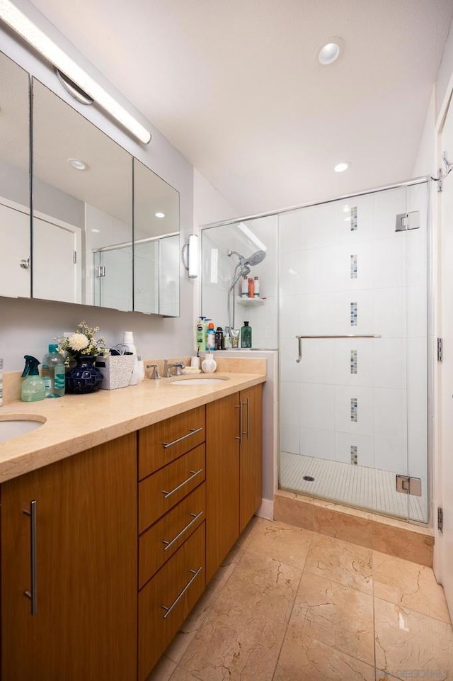 bathroom featuring vanity and an enclosed shower