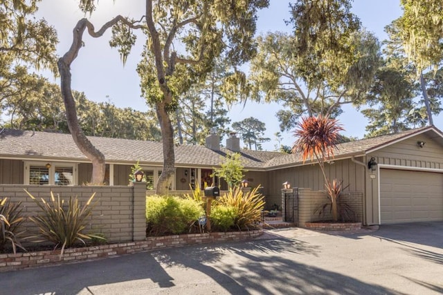 ranch-style home featuring a garage