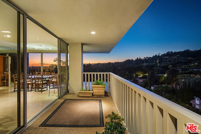 view of balcony at dusk