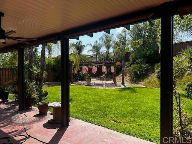 view of patio featuring ceiling fan