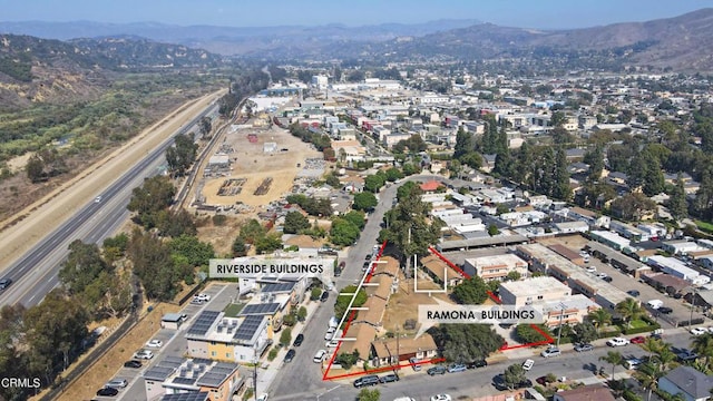 birds eye view of property with a mountain view