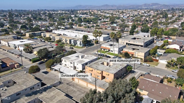 birds eye view of property with a mountain view