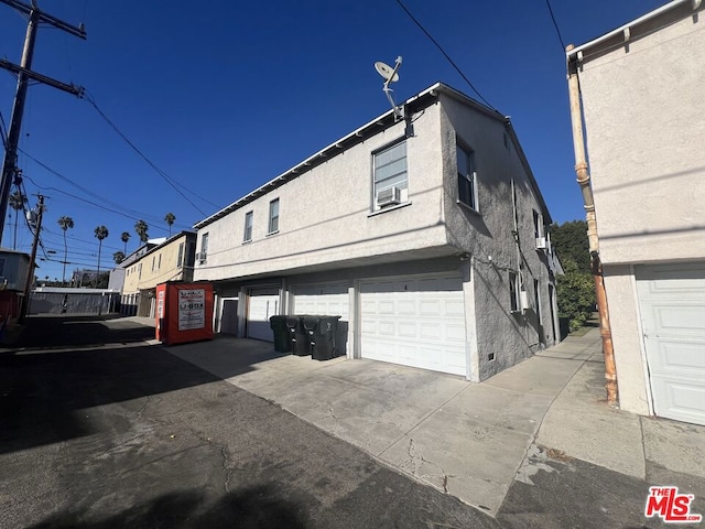 view of property exterior with a garage