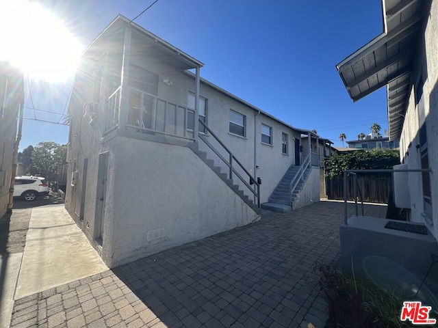 rear view of house featuring a patio area