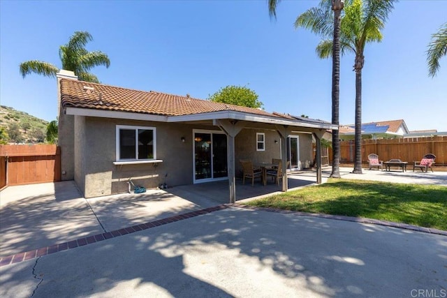 rear view of house featuring a patio