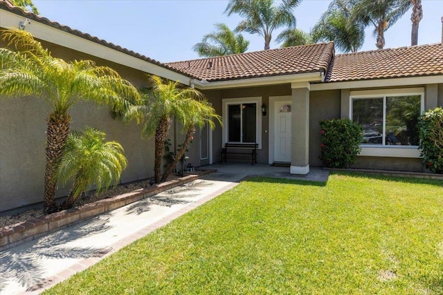 mediterranean / spanish house with a front lawn