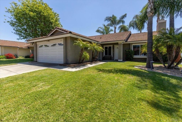 view of front facade with a front yard and a garage