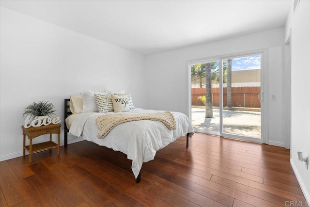 bedroom featuring access to outside and wood-type flooring