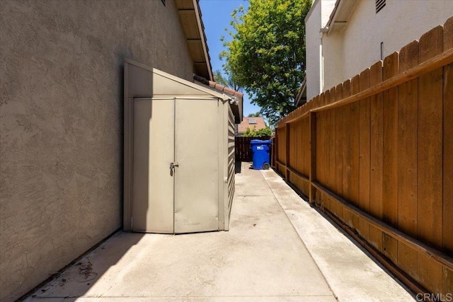 view of side of home with a patio