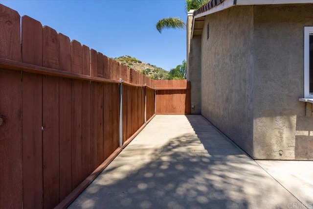 view of side of home featuring a patio