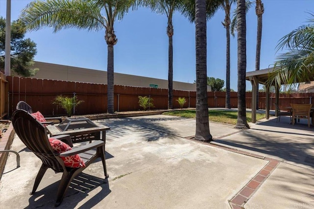 view of patio / terrace featuring a fire pit