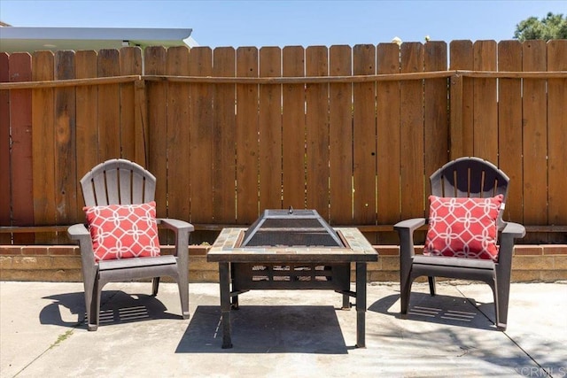 view of patio with an outdoor fire pit