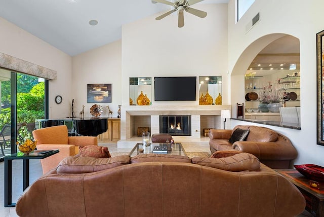 living room with high vaulted ceiling and ceiling fan