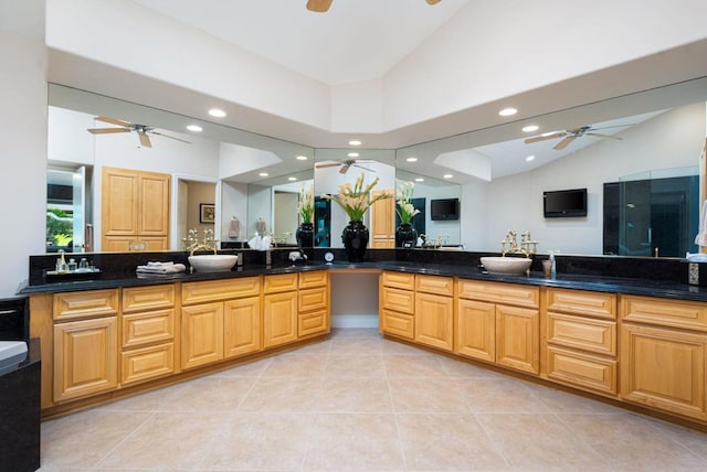 bathroom featuring high vaulted ceiling, vanity, and tile patterned flooring