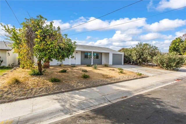 single story home with a garage