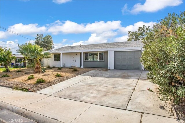 ranch-style home featuring a garage