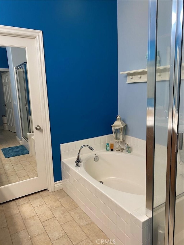 bathroom featuring separate shower and tub