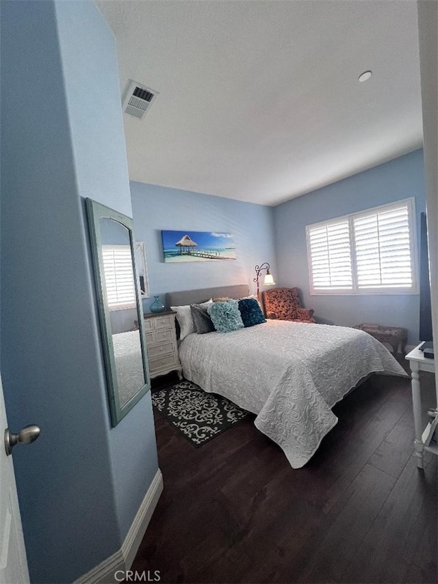 bedroom featuring dark hardwood / wood-style floors