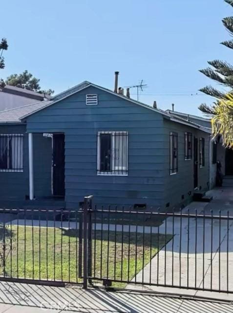 view of side of property with a yard