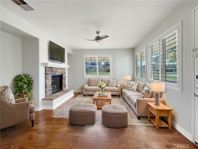 46332 Kohinoor Way, Temecula, CA 92592 - living area featuring hardwood / wood-style flooring, ceiling fan, baseboards, and a fireplace