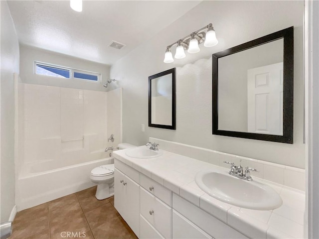 full bathroom with tile patterned floors, vanity, shower / bathing tub combination, and toilet