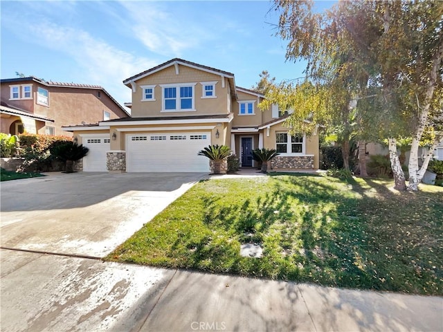 view of front of property featuring a garage and a front lawn