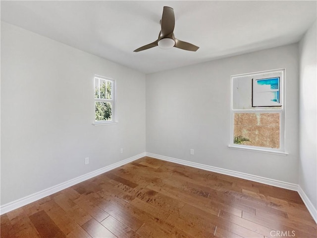 unfurnished room featuring hardwood / wood-style floors and ceiling fan