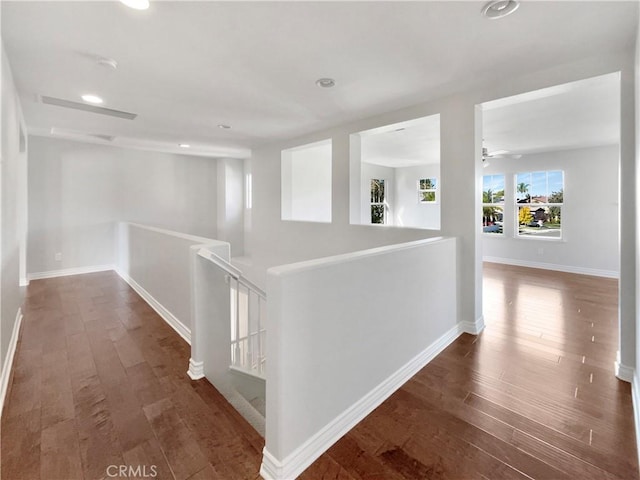 46332 Kohinoor Way, Temecula, CA 92592 - corridor featuring an upstairs landing, wood finished floors, recessed lighting, and baseboards