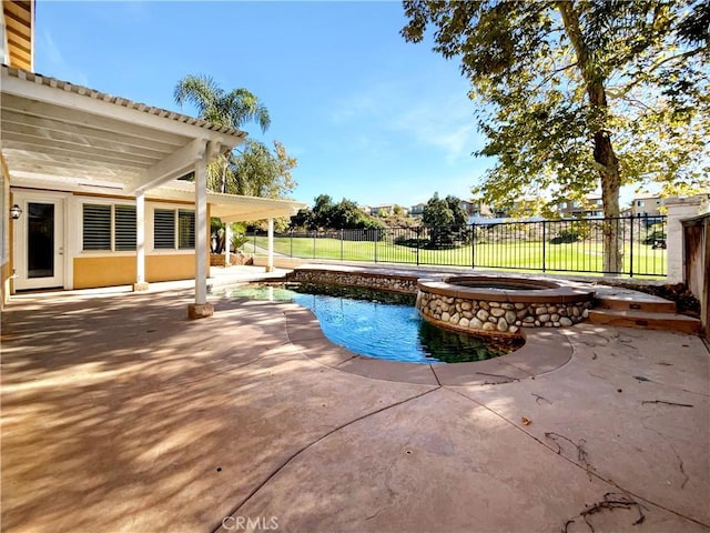 view of swimming pool featuring an in ground hot tub and a patio area