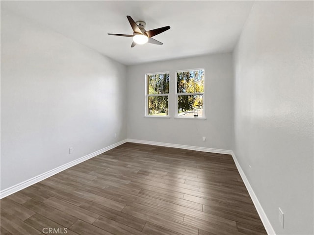 unfurnished room featuring dark hardwood / wood-style flooring and ceiling fan