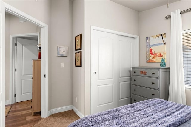 carpeted bedroom with a closet