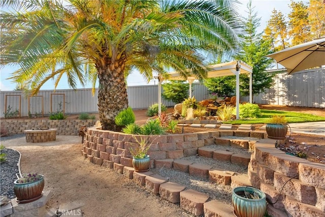 view of yard featuring a patio area and a fire pit