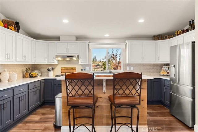 kitchen featuring stainless steel refrigerator with ice dispenser, dark wood-type flooring, gray cabinets, and white cabinetry