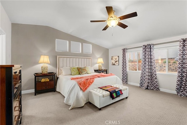 carpeted bedroom with vaulted ceiling and ceiling fan