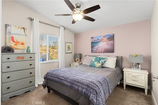 bedroom featuring ceiling fan, dark carpet, and lofted ceiling