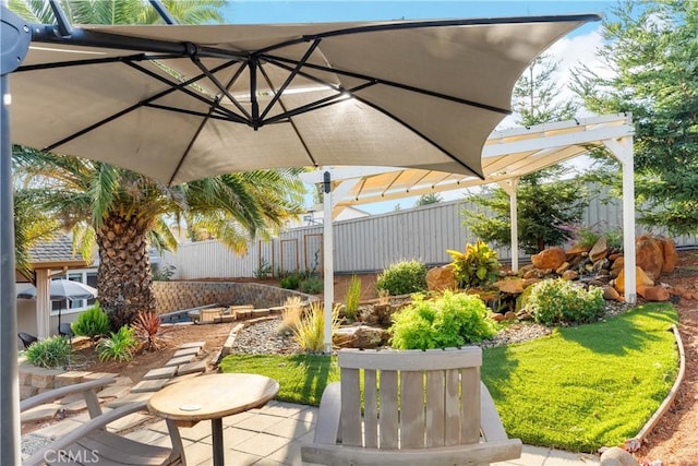 view of patio featuring a pergola