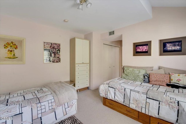 carpeted bedroom with a closet