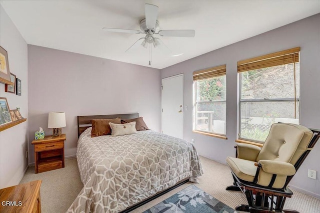 bedroom with ceiling fan and carpet floors