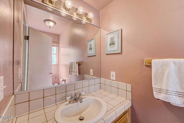 bathroom with tile patterned floors and vanity