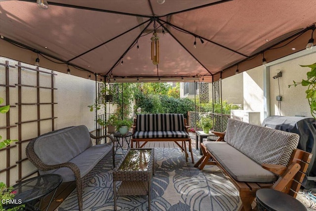 view of patio with a gazebo and an outdoor living space