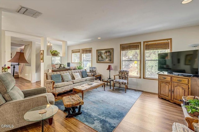 living room featuring a healthy amount of sunlight and light wood-type flooring