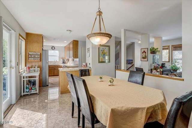 dining space with a healthy amount of sunlight