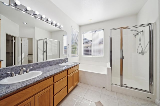 full bathroom featuring tile patterned floors, vanity, toilet, and plus walk in shower