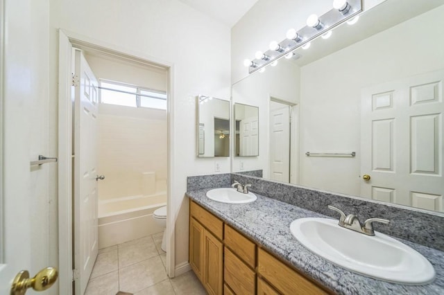 bathroom featuring toilet, vanity, and tile patterned floors