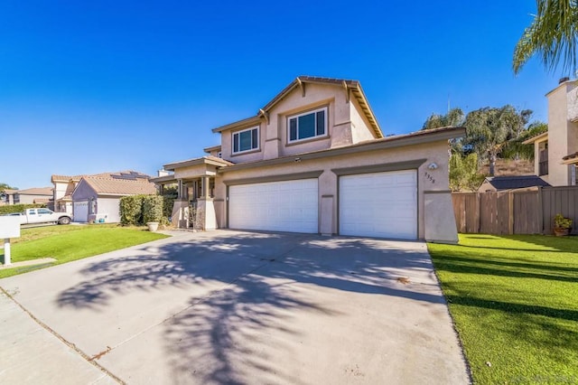 view of front of property featuring a front yard and a garage