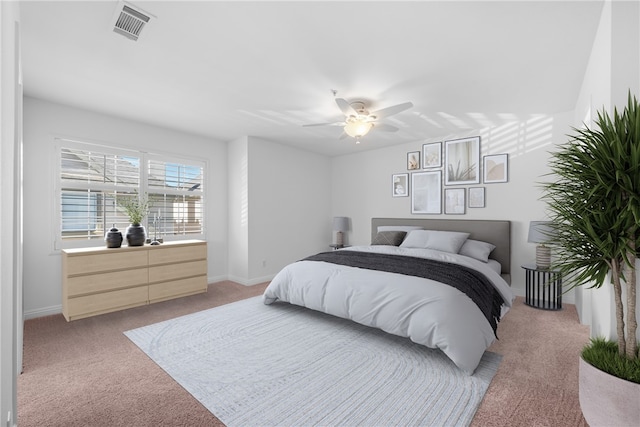 bedroom with light carpet and ceiling fan